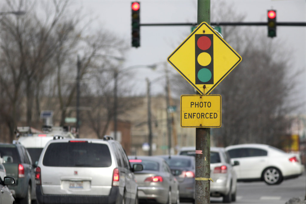 Former state lawmaker used bribes to promote red-light cameras in Chicago suburb, feds charge – Illinois Policy